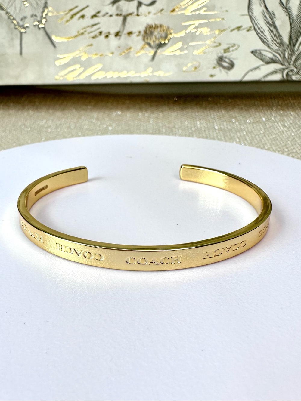 Coach Gold-Tone Logo Engraved Open Cuff Bracelet